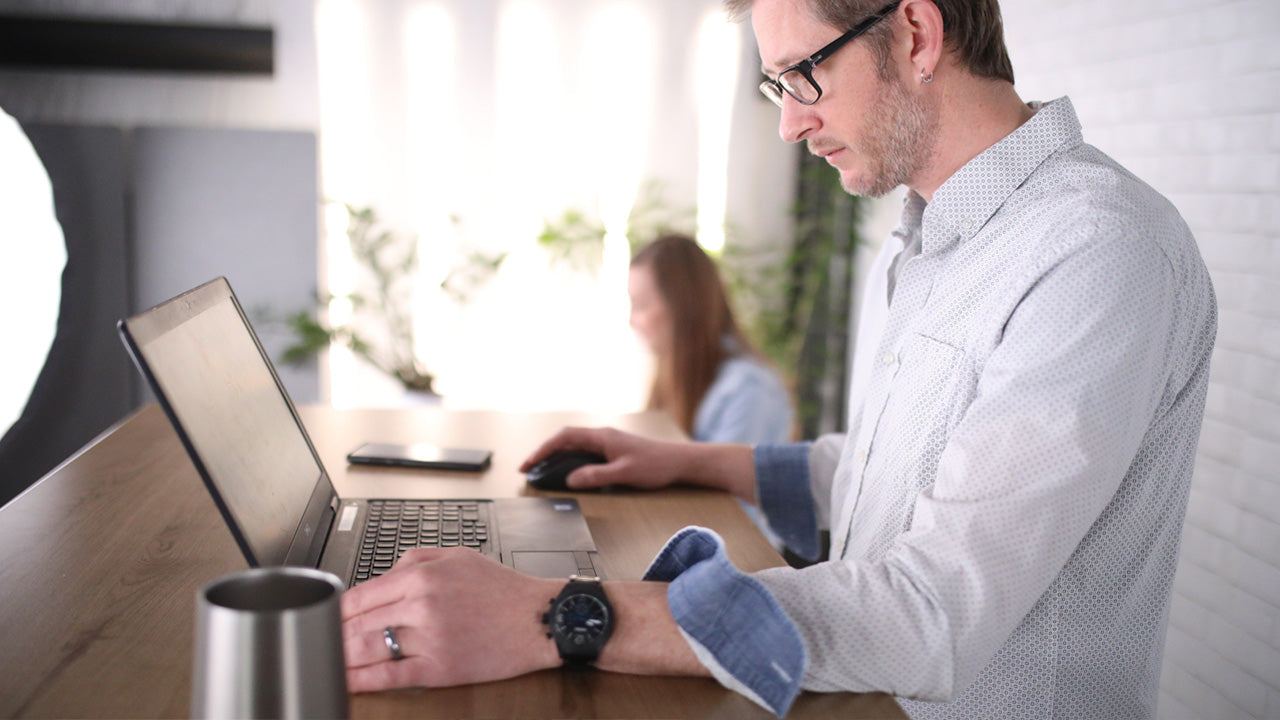 Men working on height adjustable standing desk